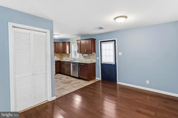 a view of kitchen with wooden floor