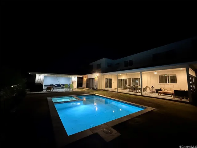 a room with furniture pool table and flat screen tv