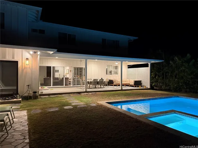 a view of swimming pool with outdoor seating
