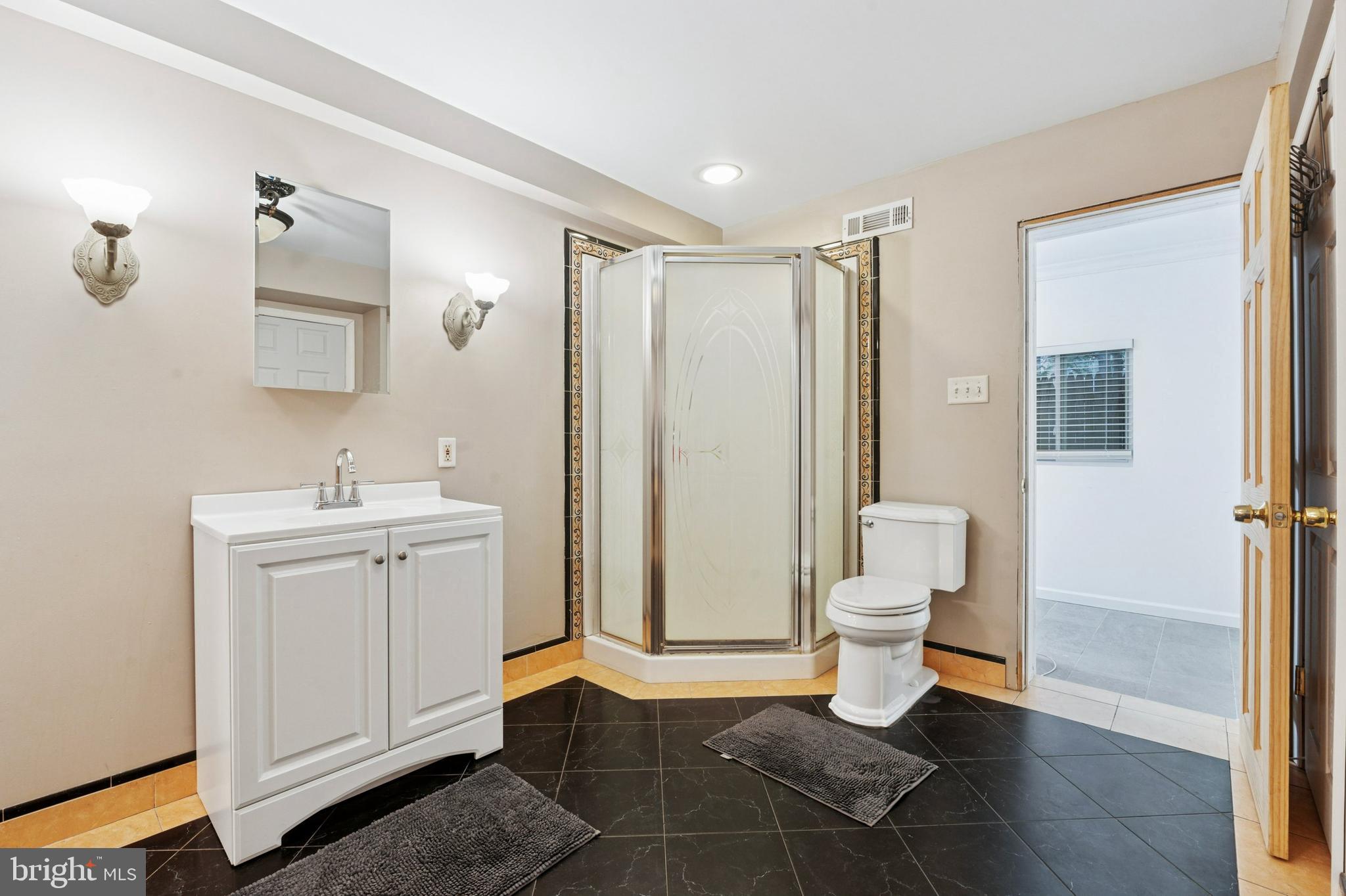 614 Wises Mill Road Philadelphia, PA 19128 - Photo 15 of 42 a bathroom with a sink and a mirror