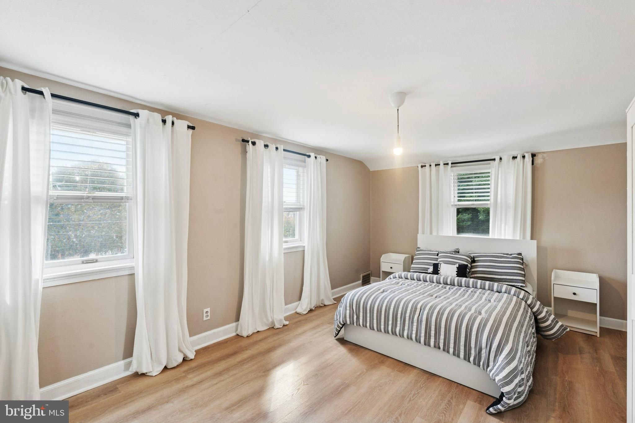 614 Wises Mill Road Philadelphia, PA 19128 - Photo 26 of 42 a bedroom with a bed and window