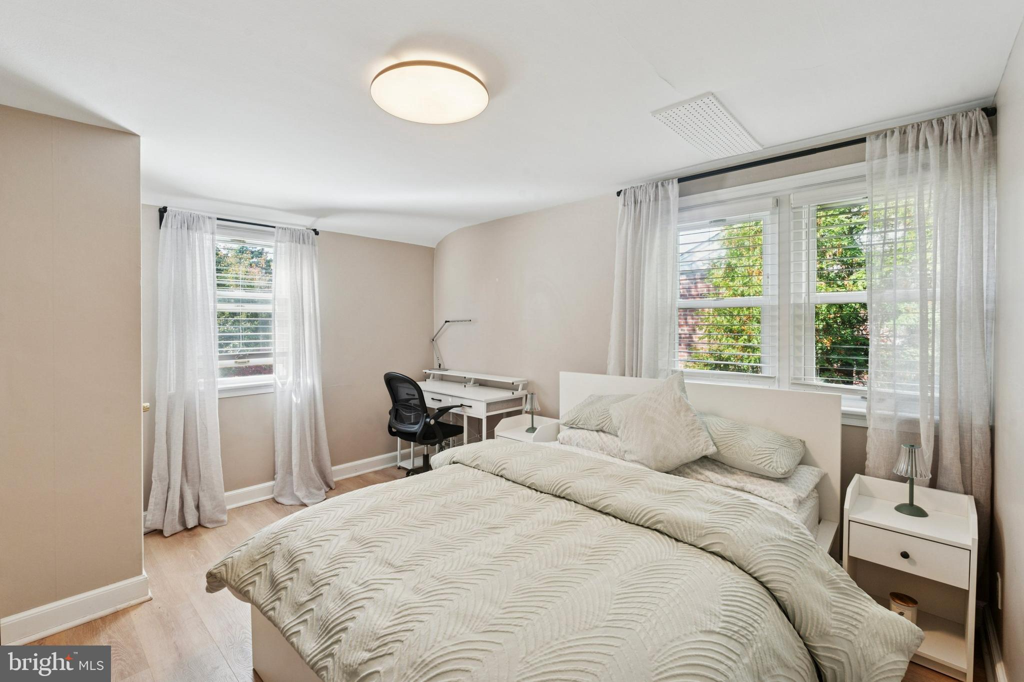 614 Wises Mill Road Philadelphia, PA 19128 - Photo 29 of 42 a bedroom with a bed and a window