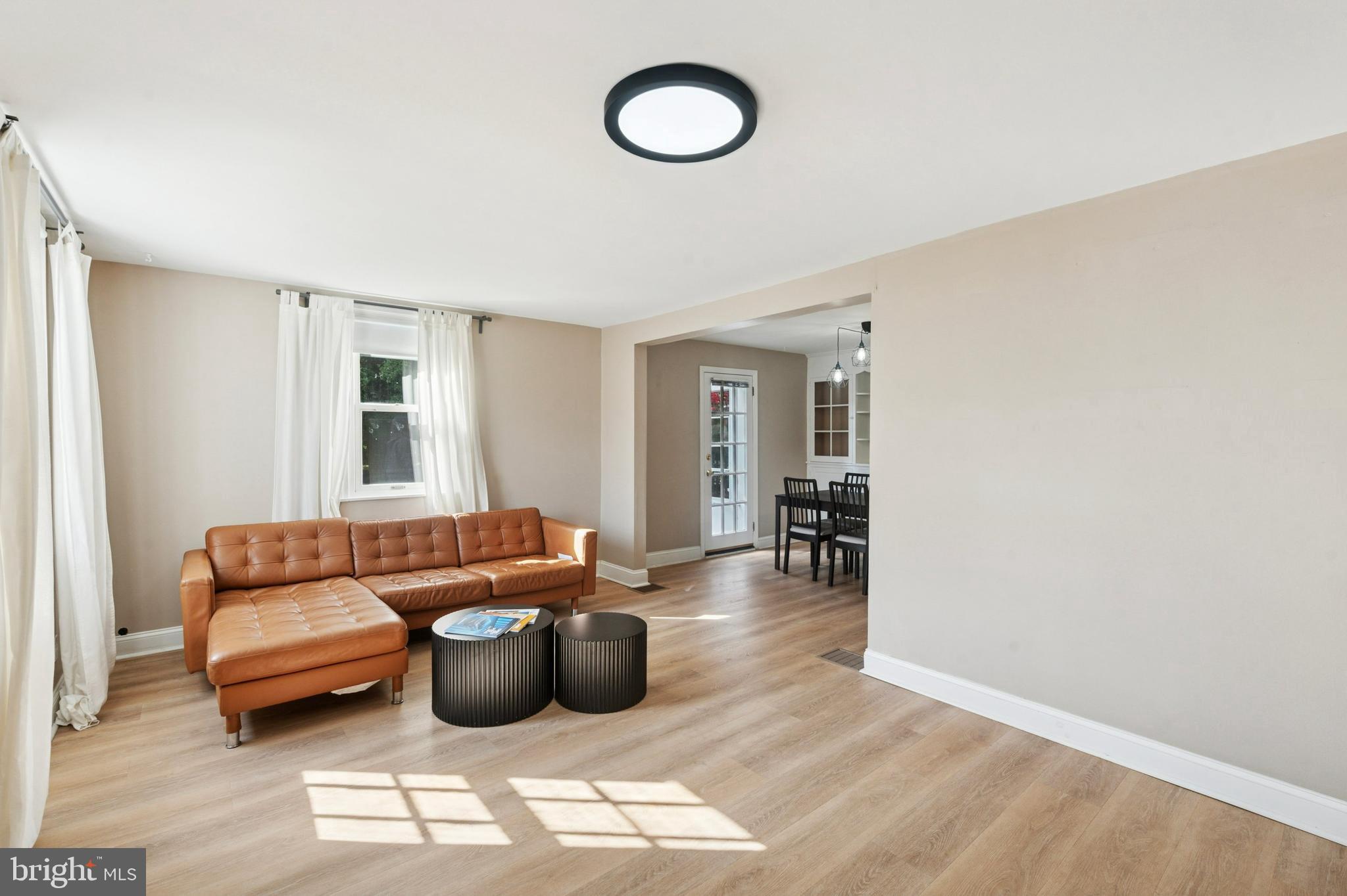 614 Wises Mill Road Philadelphia, PA 19128 - Photo 5 of 42 a living room with furniture and a window