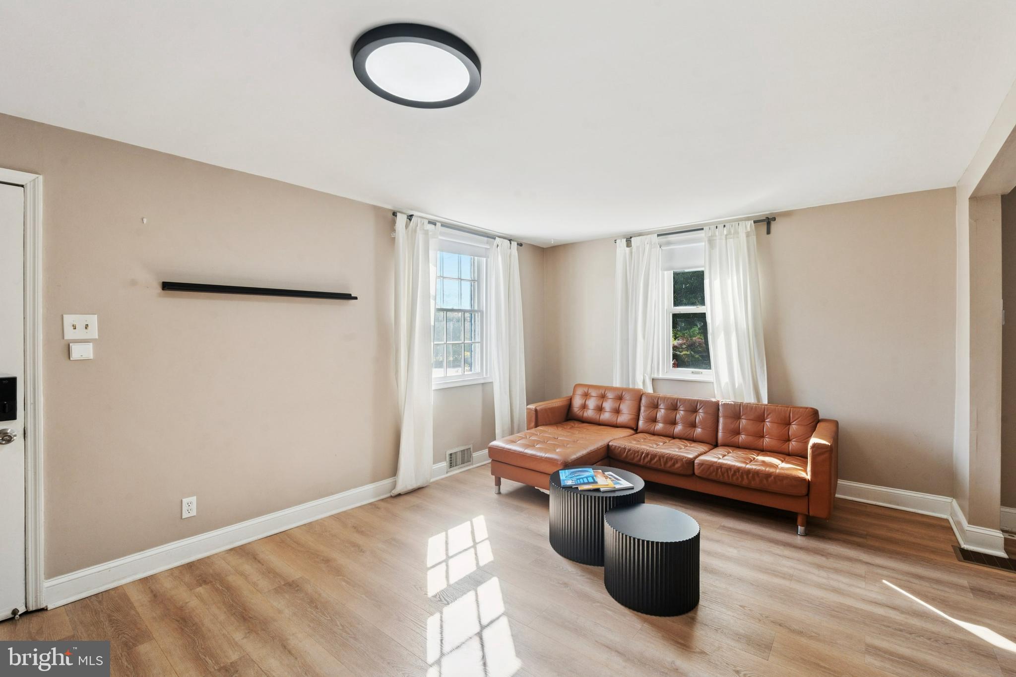 614 Wises Mill Road Philadelphia, PA 19128 - Photo 7 of 42 a living room with furniture and a window