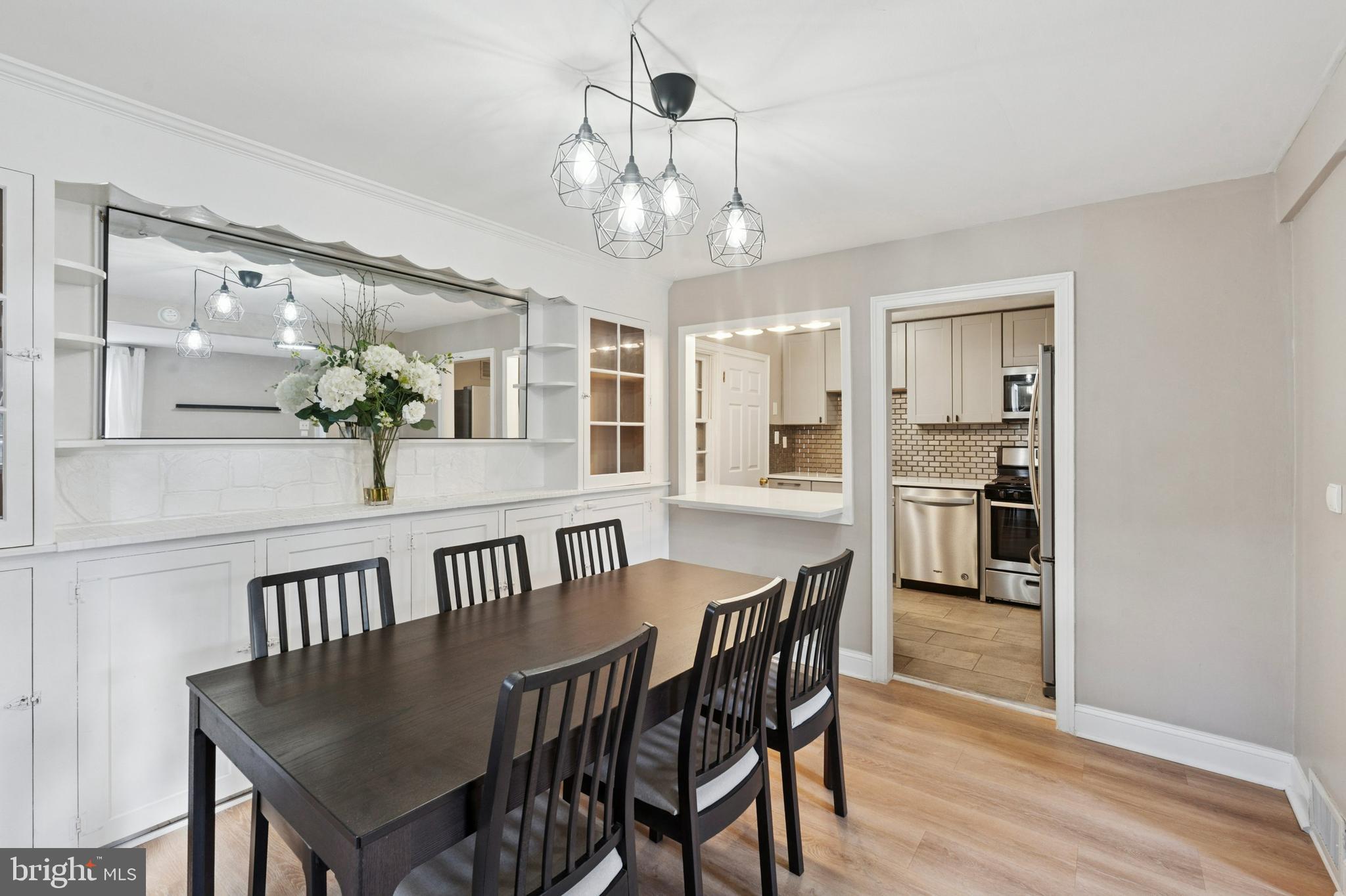614 Wises Mill Road Philadelphia, PA 19128 - Photo 8 of 42 a view of a dining room with furniture and wooden floor