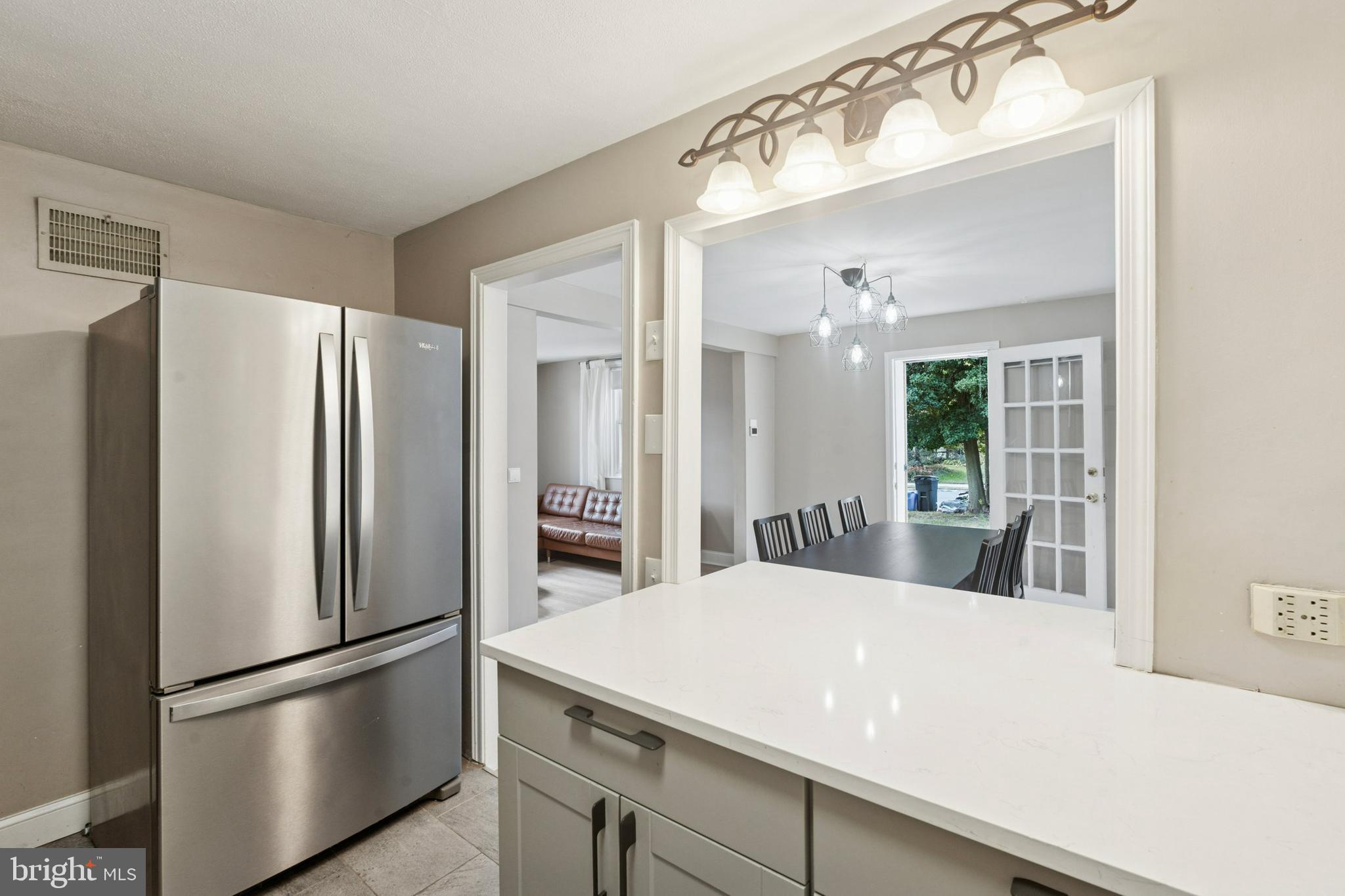 614 Wises Mill Road Philadelphia, PA 19128 - Photo 10 of 42 a kitchen with stainless steel appliances a refrigerator and microwave
