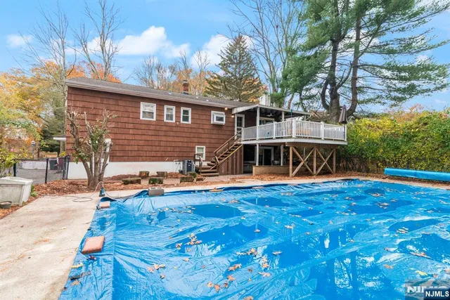 a front view of a house with yard porch and hall