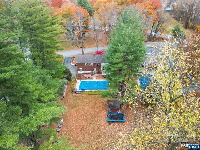 a bird view of a house with a yard