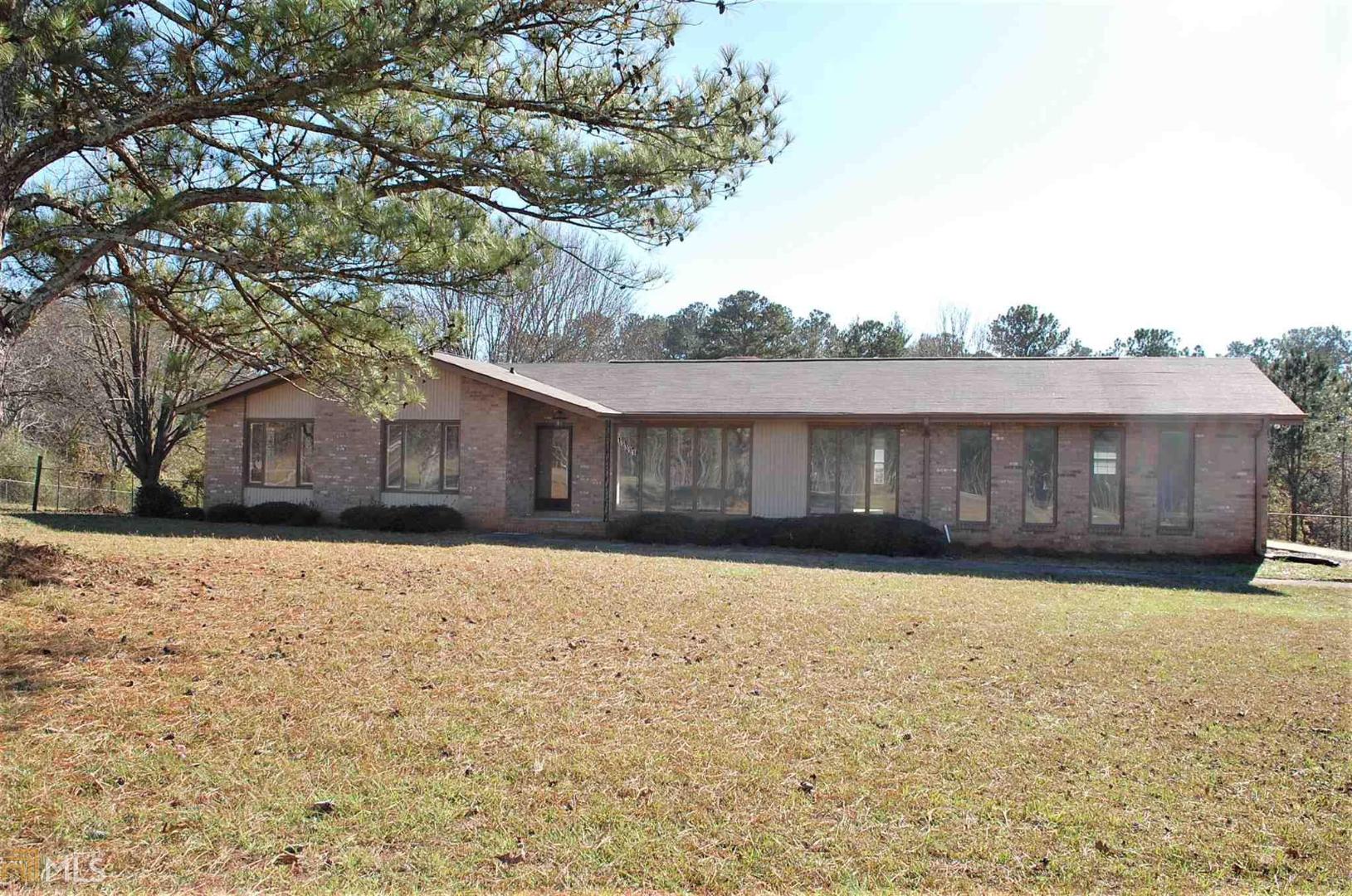 13591 Brown Bridge Road Covington, GA 30016 - Photo 1 of 1 a view of a house with a yard