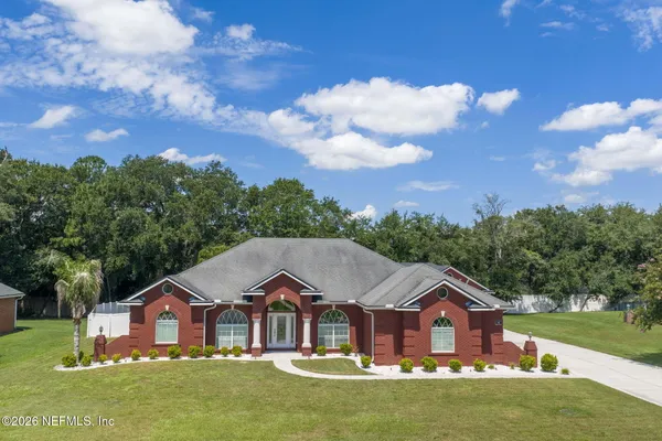 a front view of a house with outdoor seating