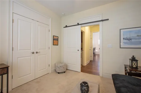 a view of a livingroom with furniture and cabinet area