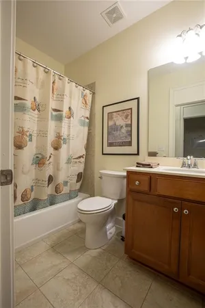 a bathroom with a toilet a sink and a bathtub
