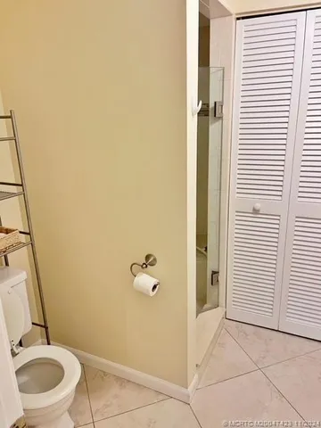 a bathroom with a sink vanity and a mirror