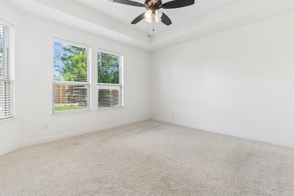 5224 Troupe Road McKinney, TX 75071 - Photo 18 of 31 Recessed ceiling, neutral carpeting, multiple windows with blinds, ceiling fan with light fixture