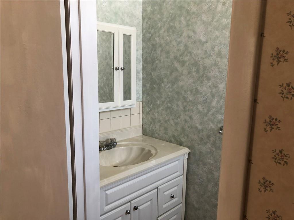 140 Redstone Furnace Road Hopwood, PA 15445 - Photo 22 of 38 a bathroom with a granite countertop sink and vanity