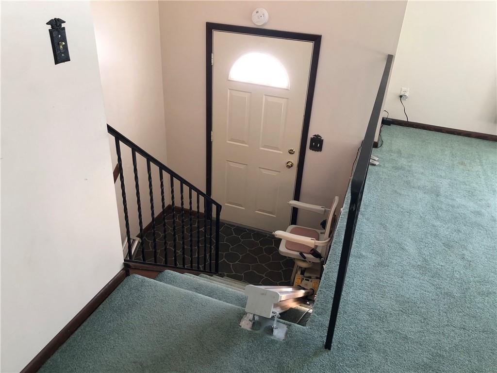 140 Redstone Furnace Road Hopwood, PA 15445 - Photo 26 of 38 a view of a hallway with wooden floor and stairs