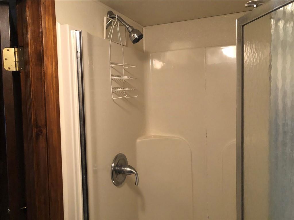 140 Redstone Furnace Road Hopwood, PA 15445 - Photo 33 of 38 a bathroom with a glass shower door