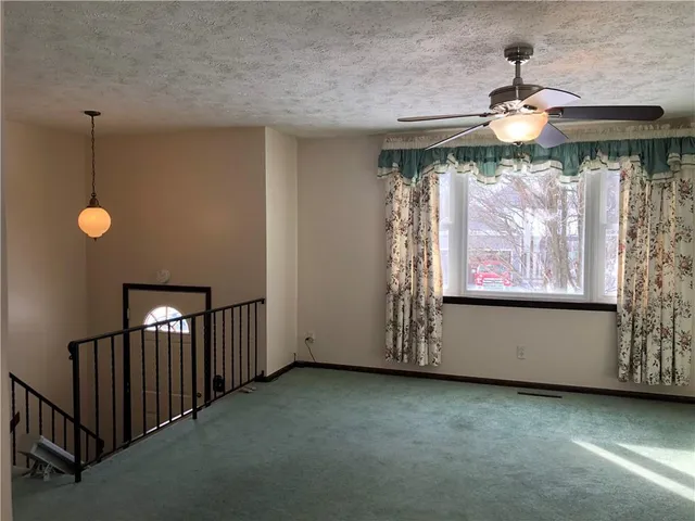 a view of empty room with windows