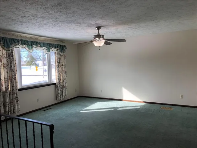 a kitchen with a sink and a refrigerator