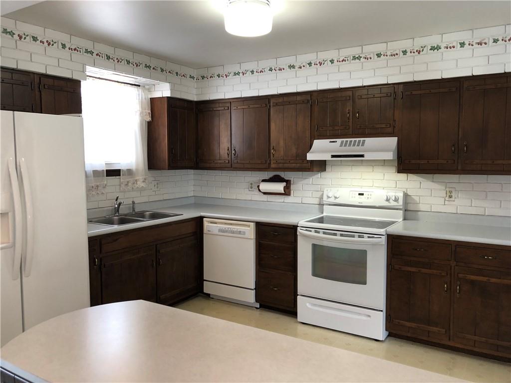 140 Redstone Furnace Road Hopwood, PA 15445 - Photo 10 of 38 a kitchen with a stove and a sink