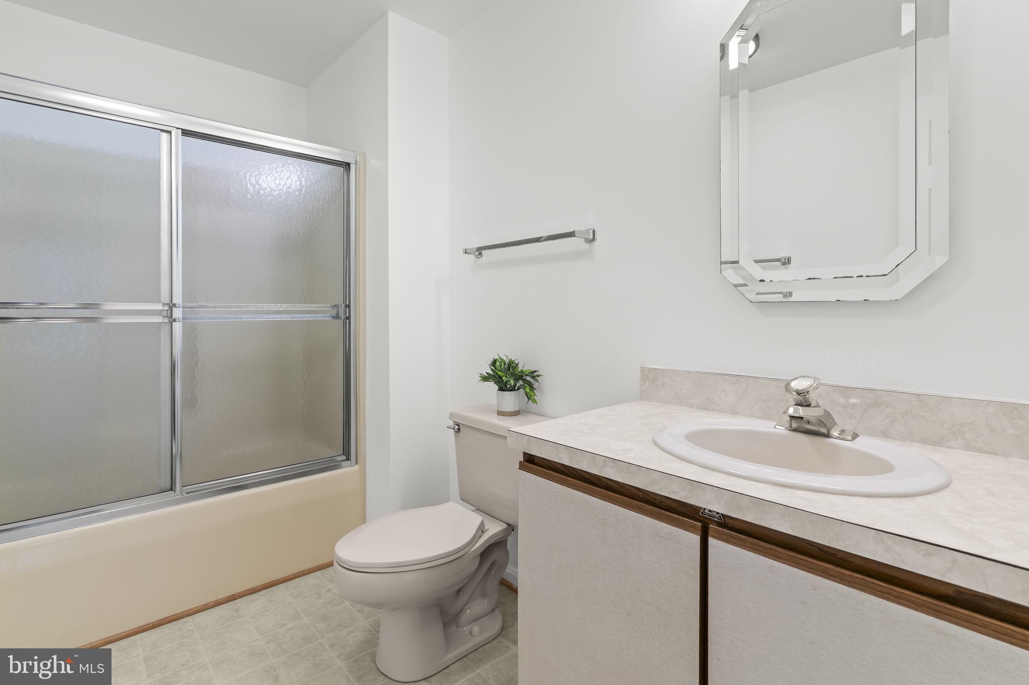 11223 Rawhide Road Lusby, MD 20657 - Photo 14 of 33 a bathroom with a sink toilet and shower