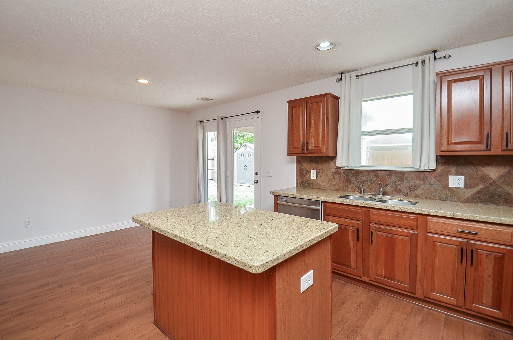 29610 Benson Springs Lane Spring, TX 77386 - Photo 13 of 25 a kitchen with a sink window and cabinets