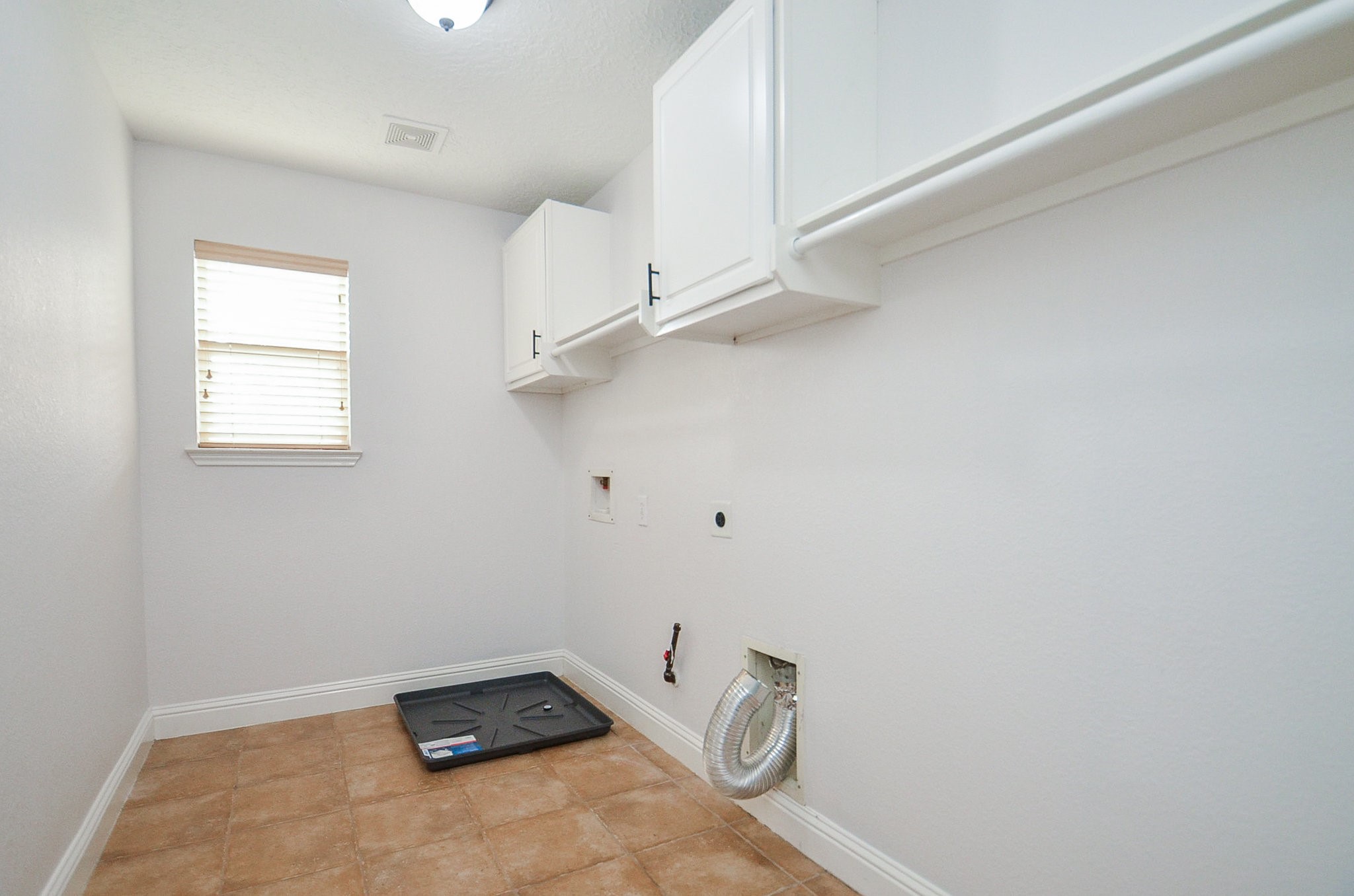 29610 Benson Springs Lane Spring, TX 77386 - Photo 21 of 25 a view of a room with rack on the wall