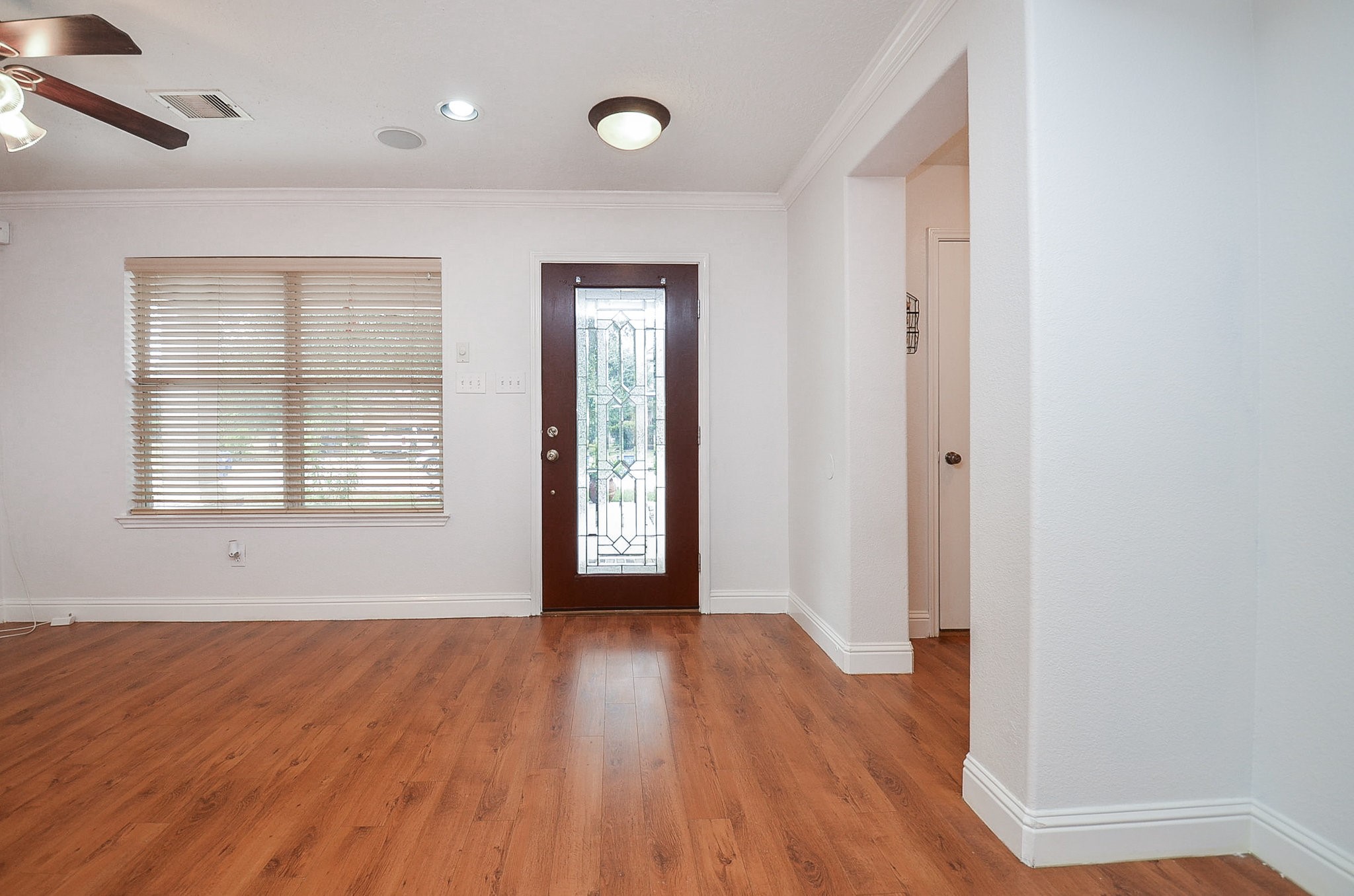 29610 Benson Springs Lane Spring, TX 77386 - Photo 6 of 25 an empty room with wooden floor and windows