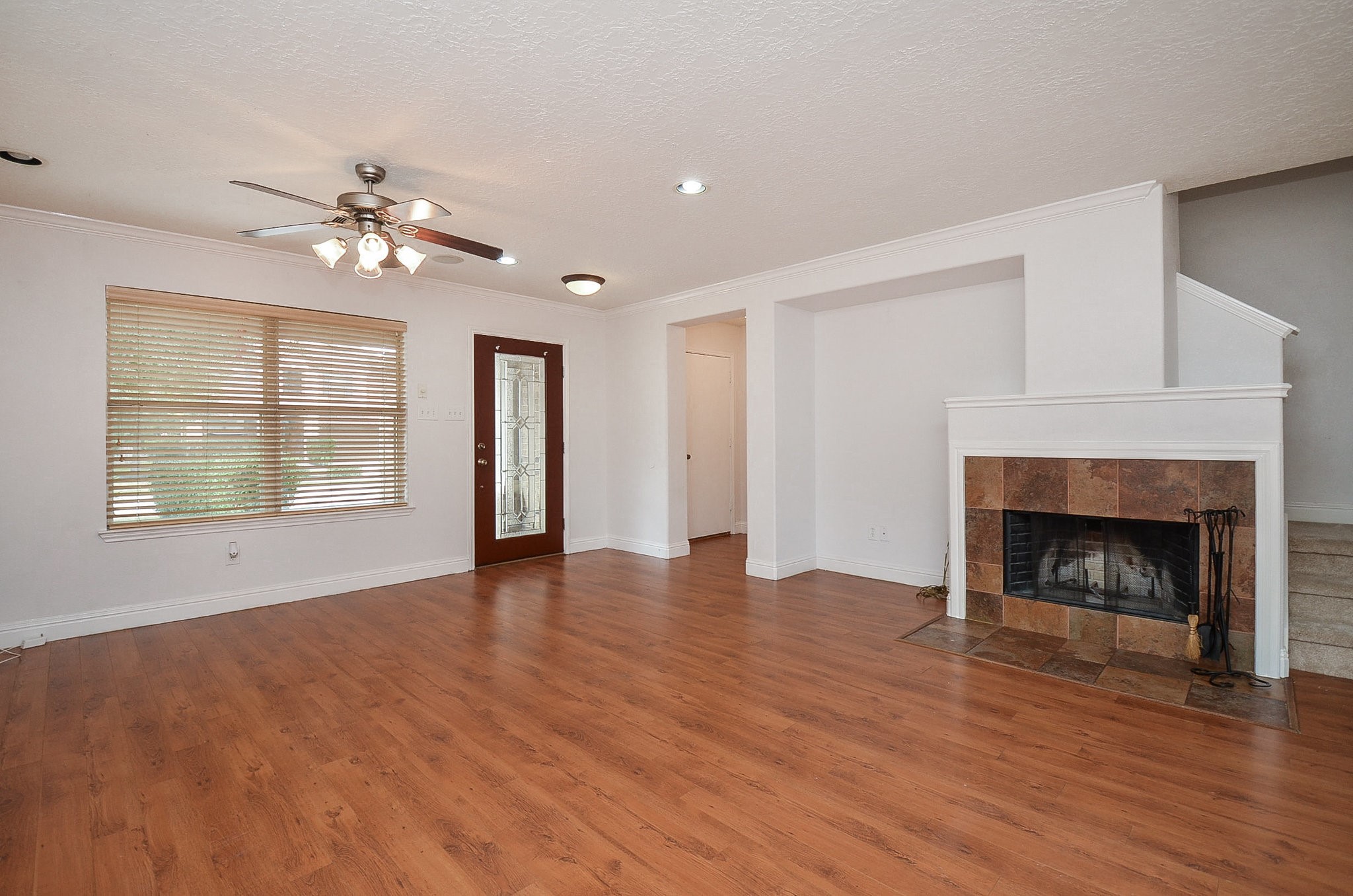 29610 Benson Springs Lane Spring, TX 77386 - Photo 7 of 25 a view of an empty room with wooden floor fireplace and a window