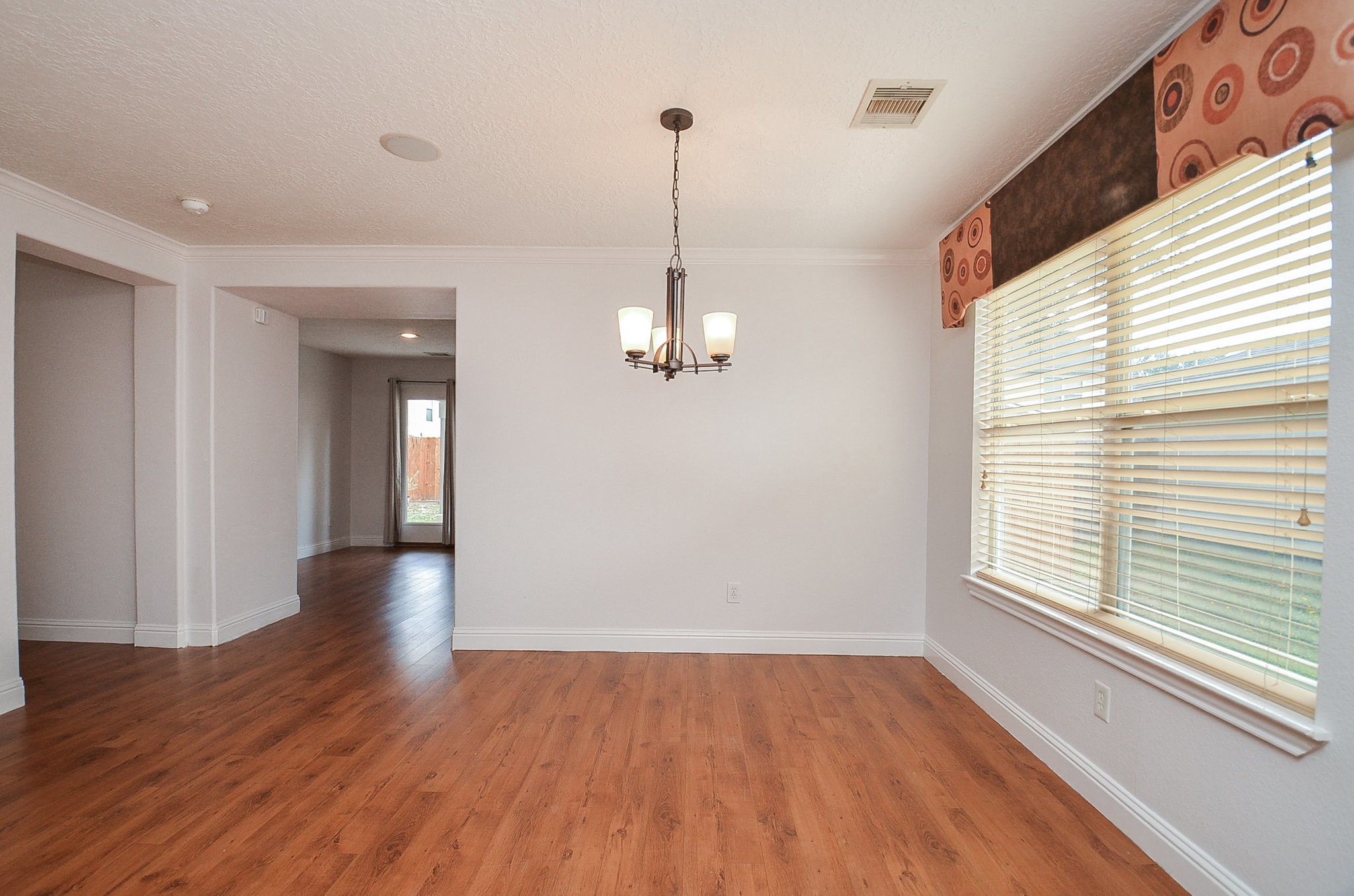 29610 Benson Springs Lane Spring, TX 77386 - Photo 9 of 25 a view of a room with wooden floor window and a ceiling fan