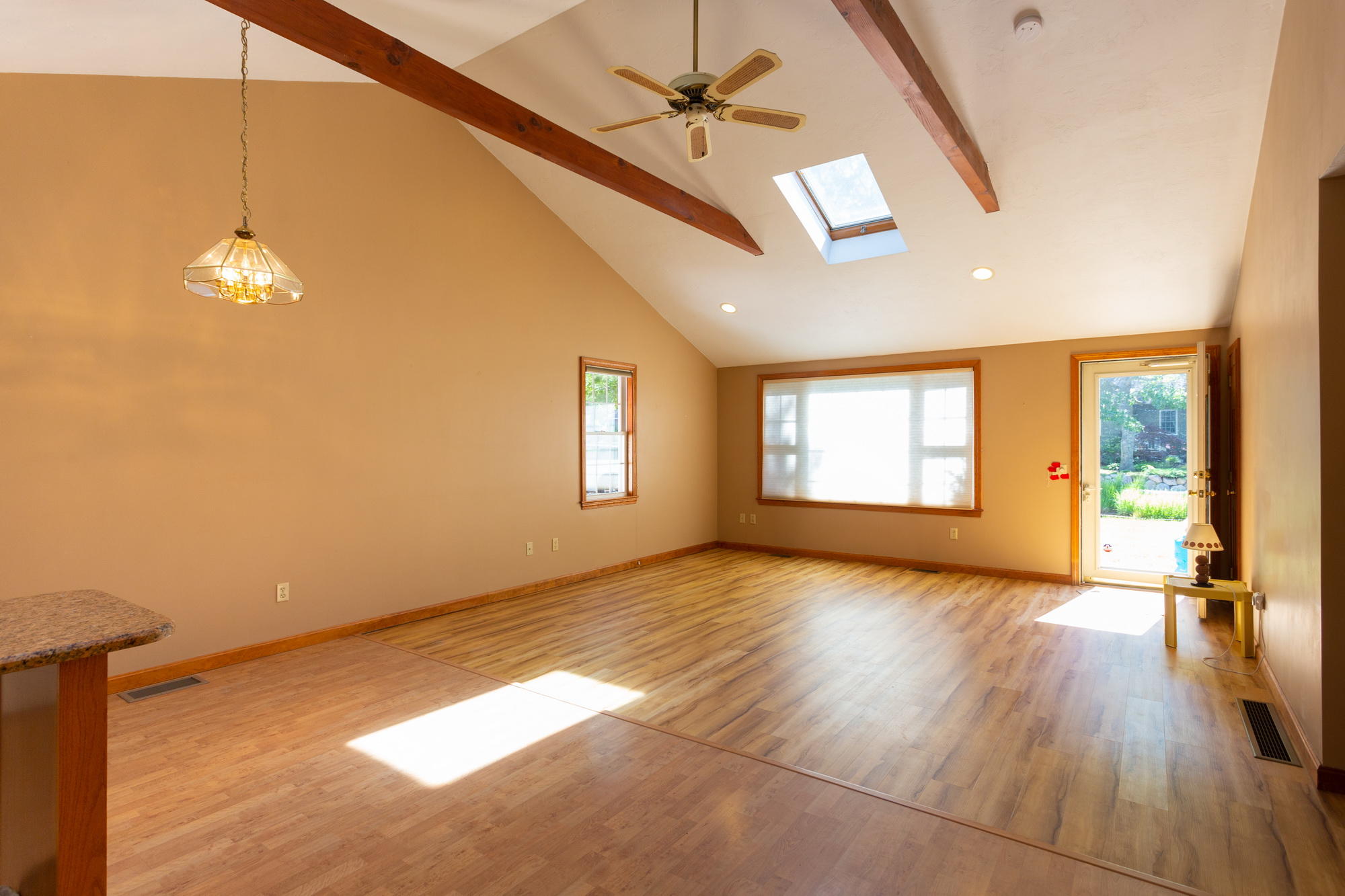307 Strawberry Hill Road Centerville, MA 02632 - Photo 17 of 28 a view of an empty room with a window and wooden floor