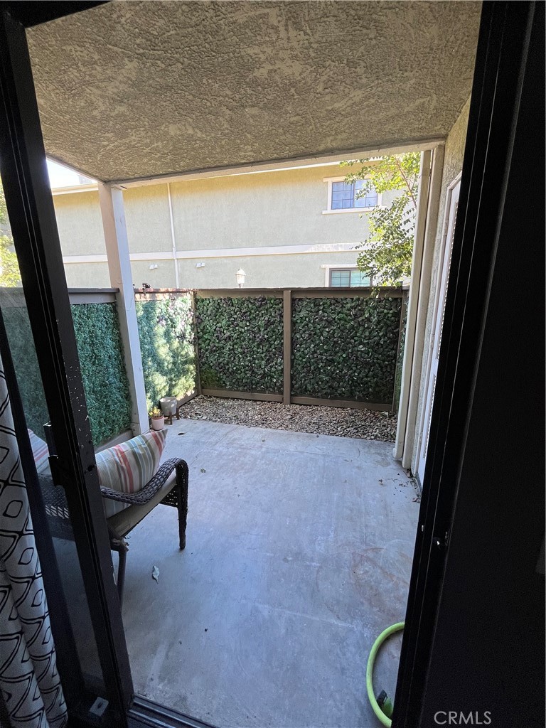 1111 Packers Circle, Unit 25 Tustin, CA 92780 - Photo 8 of 10 a view of an outdoor space with porch