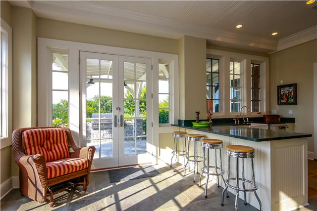 4545 Peytonsville Road Franklin, TN 37064 - Photo 17 of 20 ALL SEASON PORCH WITH SLATE FLOORING, REFRIGERATOR & FREEZER DRAWERS, DISHWASHER, MICROWAVE AND 2 SETS OF FRECH DOORS OVERLOOKING GAS GRILL, GUNITE POOL, SPA AND GAS FIREPLACE