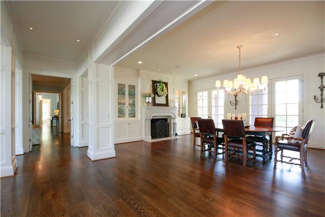 4545 Peytonsville Road Franklin, TN 37064 - Photo 6 of 20 THE OVERSIZED DINING ROOM IS THE FOCAL POINT AFTER ENTERING THIS ESTATE. THE DINING ROOM FEATURES A WOOD BURNING FIREPLACE, BUILT-IN GLASS CABINETS, DESIGNER LIGHT FIXTURE AND 4 SETS OF FRENCH DOORS.