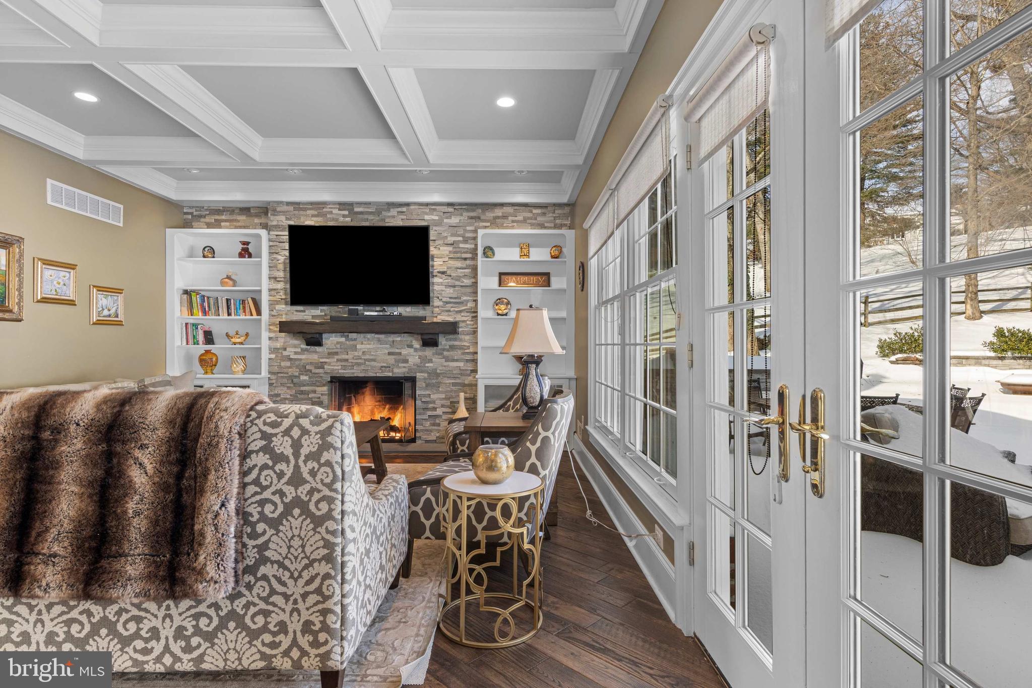 731 King Of Prussia Road Radnor, PA 19087 - Photo 7 of 58 living room with gas fireplace and patio access