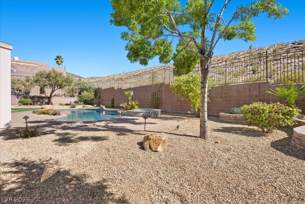 2125 De Rouge Avenue Henderson, NV 89044 - Photo 75 of 96 An inviting pool and spa create a private oasis for relaxation and enjoyment.