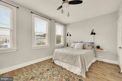 a bedroom with bed and window
