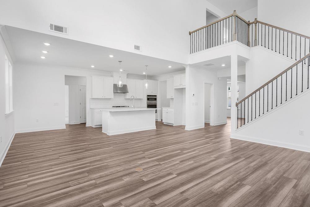 8925 Avonbrook Cl Ball Ground, GA 30107 - Photo 11 of 48 a view of kitchen with wooden floor