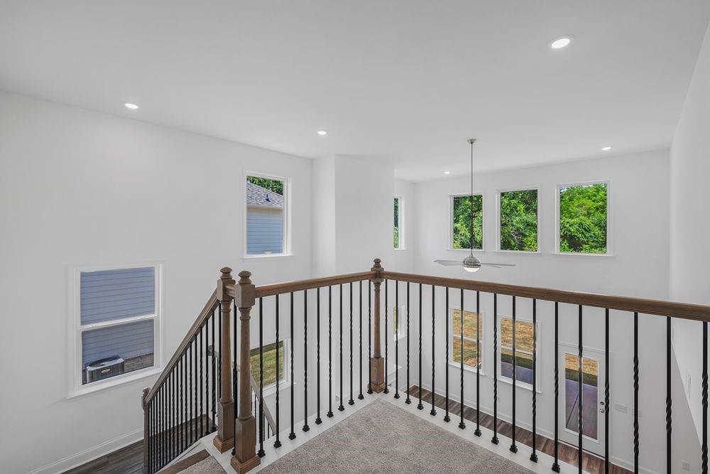 8925 Avonbrook Cl Ball Ground, GA 30107 - Photo 14 of 48 a view of hallway with window