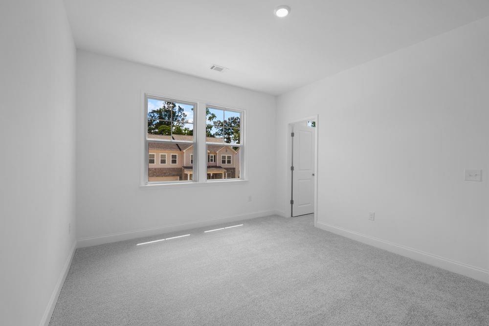 8925 Avonbrook Cl Ball Ground, GA 30107 - Photo 21 of 48 an empty room with windows