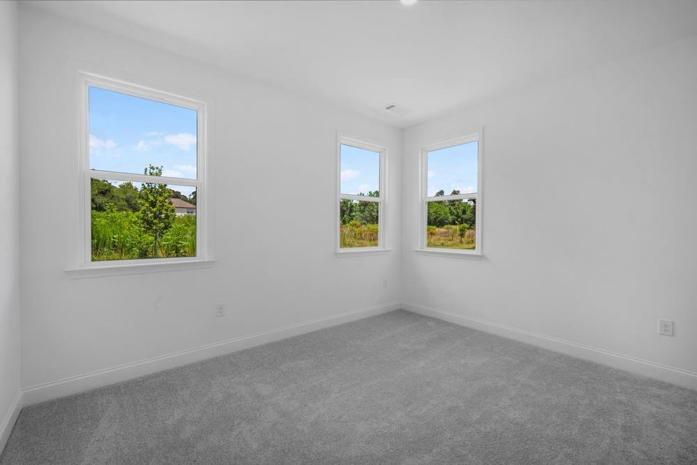 8925 Avonbrook Cl Ball Ground, GA 30107 - Photo 24 of 48 an empty room with windows