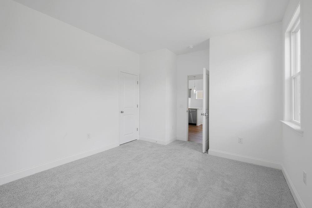 8925 Avonbrook Cl Ball Ground, GA 30107 - Photo 25 of 48 a view of an empty room and window