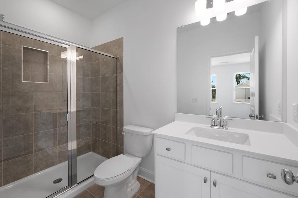 8925 Avonbrook Cl Ball Ground, GA 30107 - Photo 28 of 48 a bathroom with a sink toilet and shower