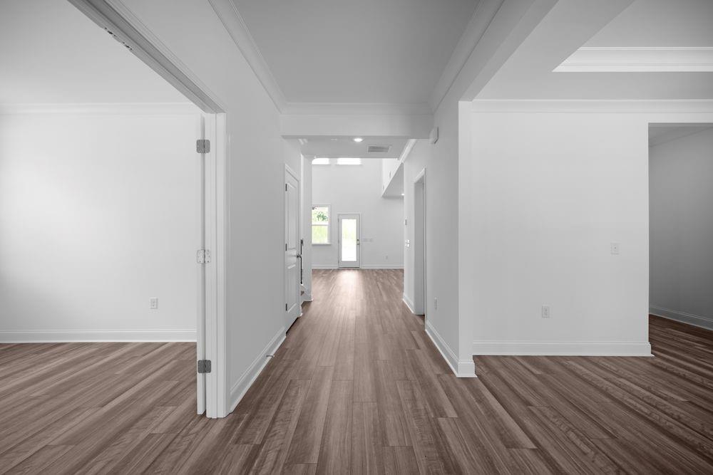 8925 Avonbrook Cl Ball Ground, GA 30107 - Photo 4 of 48 a view of a hallway with wooden floor