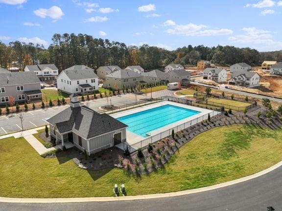 8925 Avonbrook Cl Ball Ground, GA 30107 - Photo 47 of 48 a view of a swimming pool with a lake view