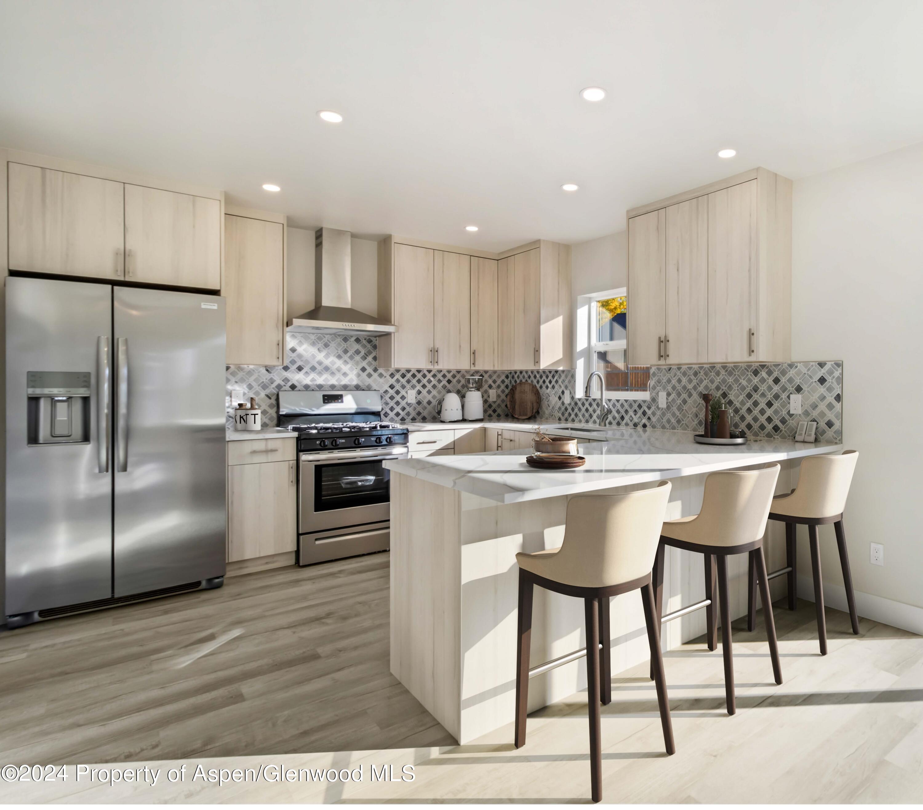 1762 Belgian Loop Silt, CO 81652 - Photo 1 of 18 a kitchen with kitchen island granite countertop wooden cabinets and stainless steel appliances