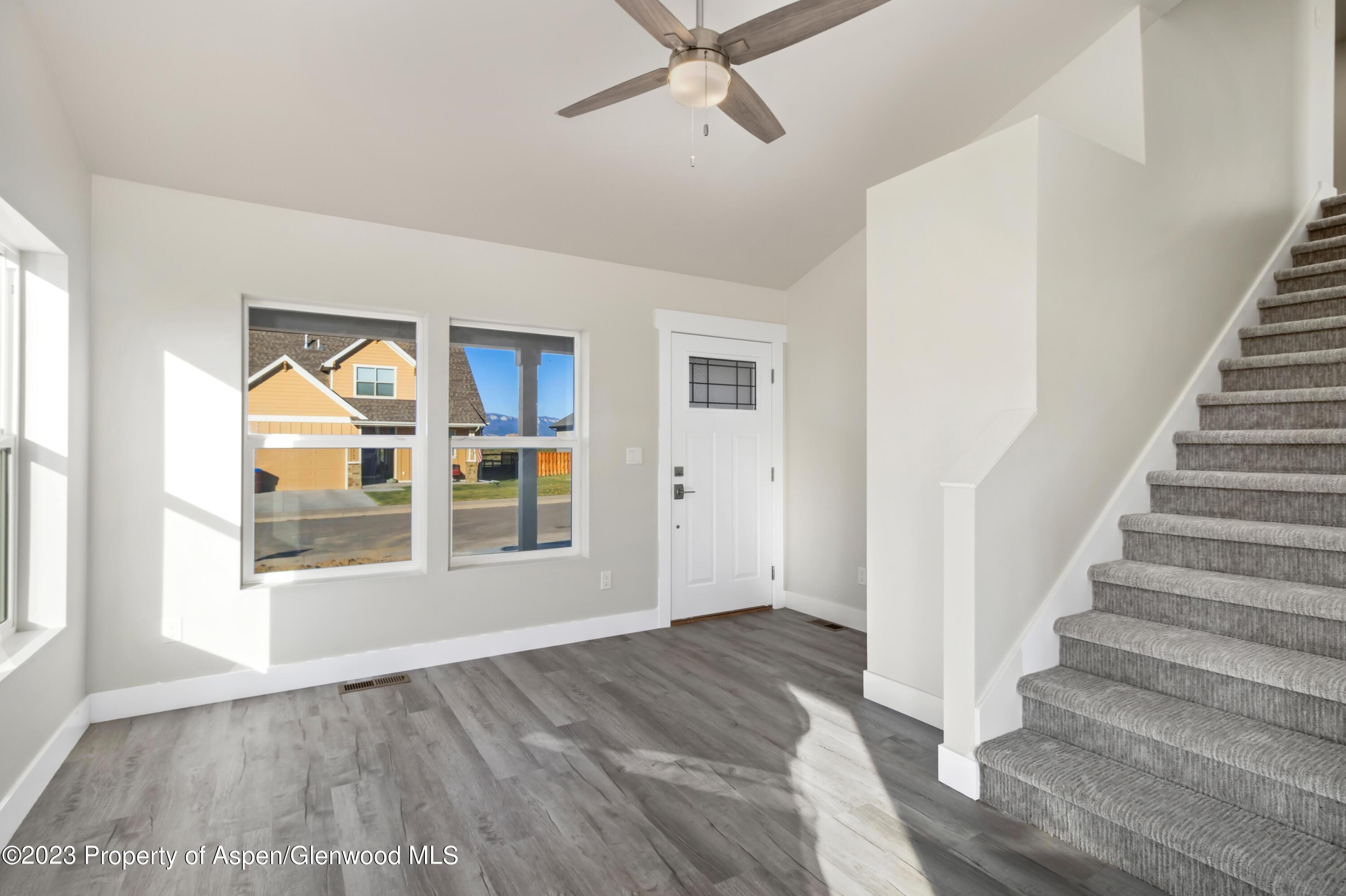 1762 Belgian Loop Silt, CO 81652 - Photo 6 of 18 a view of an entryway with wooden floor and door