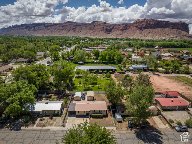 527 Palisade Drive Moab, UT 84532 - Photo 39 of 51 Aerial perspective of suburban area with a mountain backdrop
