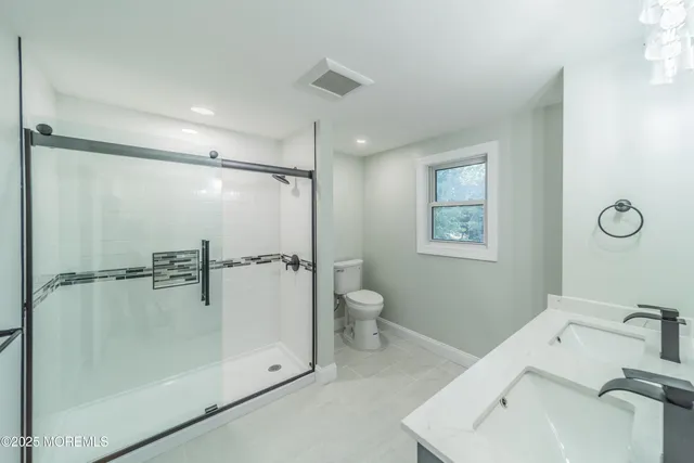 a bathroom with a shower and a toilet
