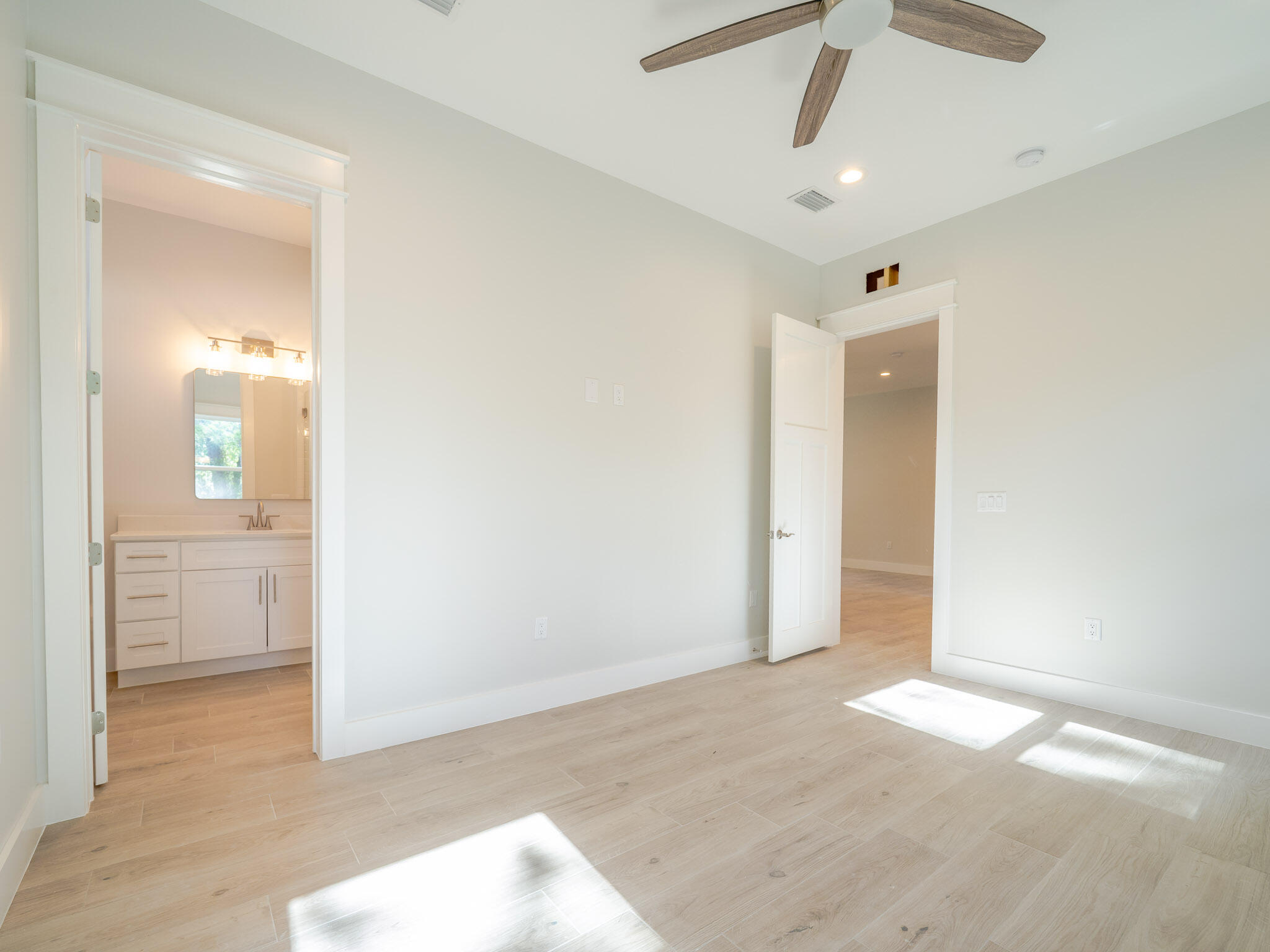 116 East Georgie Street Point Washington, FL 32459 - Photo 27 of 46 an empty room with cabinet and mirrors